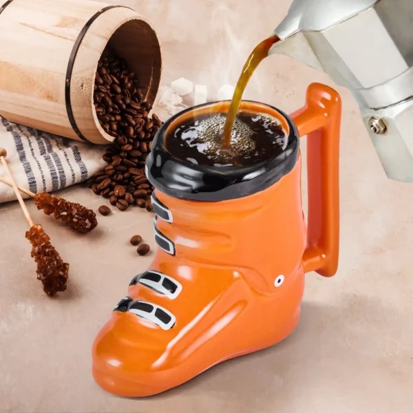 coffee being poured into a ski boot mug